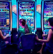 Live dealer shaking dice in a transparent cage during a Super Sic Bo round